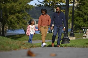 a family walking in a park at Beckington, Leland, NC, 28451